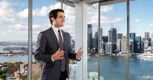 Male professional in corner office overlooking Sydney